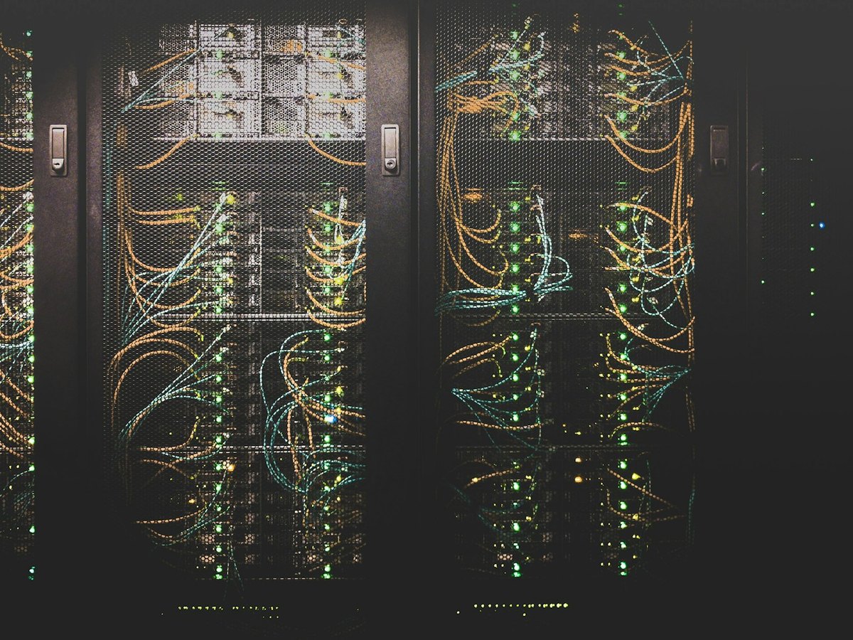 Rows of connected server racks in a data center